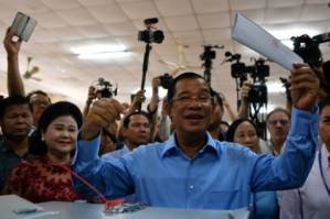 Cambodia ruling party claims 'huge victory' in vote decried as 'sham'.jpg
