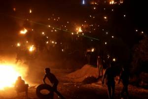 Palestinians smoke out settlers.jpg