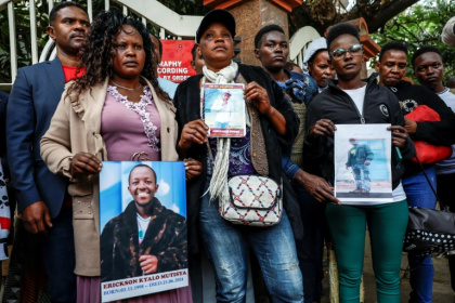Kenyans protest with photographs of disappeared or deceased family members