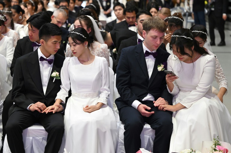'Happiness, love' at Moonie mass wedding after Japanese court blow