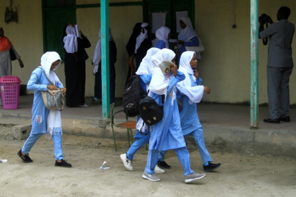 Students arrive for exams in Port Sudan on December 28, 2024 -- even before the country's war a Save the Children analysis ranked Sudan among those most at risk of educational collapse
