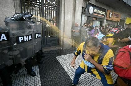 Heavily-armored police used tear gas and pepper spray on stone-throwing protesters at a demonstration in Buenos Aires against pensioners' loss of purchasing power