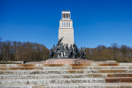 A bell-tower and monument stand at the Buchenwald concentration camp's memorial site