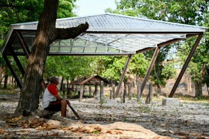 A new coffin-shaped structure topped with a clear plastic roof looms over the cremation site of Pol Pot in Cambodia's Anlong Veng
