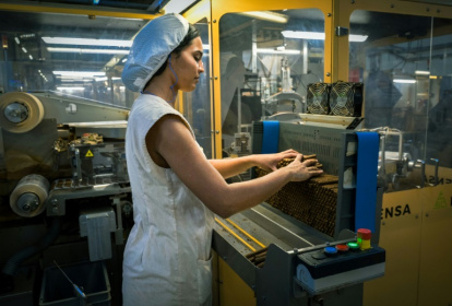 The ICT factory's 64 cigarillo-making machines can roll out 800,000 per day - ADALBERTO ROQUE (AFP)