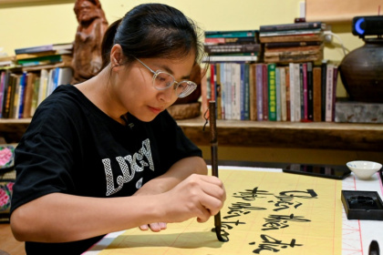 The history of romanised Vietnamese, or "Quoc Ngu", links the arrival of the first Christian missionaries, colonisation by the French and the rise to power of the Communist Party - Nhac NGUYEN (AFP)