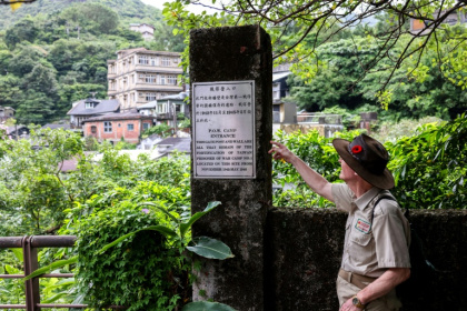 Michael Hurst, founder and director of the Taiwan PoW Camps Memorial Society, shows an entrance of a camp at Jinguashi - I-Hwa Cheng (AFP)