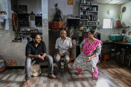 Bipinkumar Padaya (C) live in a one-storey home crammed into a tangle of alleys - Indranil MUKHERJEE (AFP)