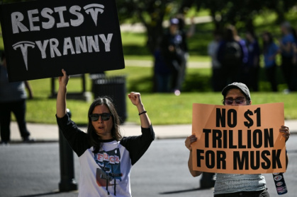 Opponents of Elon Musk's $1 trillion pay package rallied against the plan on the eve of Tesla's annual meeting - RONALDO SCHEMIDT (AFP)