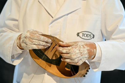 Tod's iconic leather shoes are handmade, but Italian prosecutors say they have found 'degrading' conditions at its Chinese subcontractors - Gabriel BOUYS (AFP)