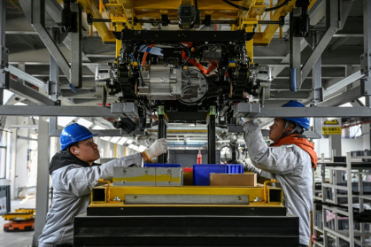 China is already the world's largest market for industrial robots, and the government is pouring billions of dollars into robotics and artificial intelligence to boost its presence in the sector - Jade GAO (AFP)