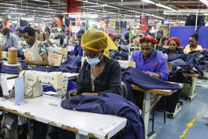Workers make jeans at the United Aryan textile factory in Nairobi - SIMON MAINA (AFP)