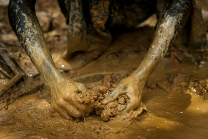 An illegal gold panner clears  mud and sand at a gold field in Kibi before Accra banned such activities accusing the miners of polluting the environment - Chris Stein (AFP)