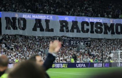 A banner against racism was hung at the Santiago Bernabeu ahead of the second leg of the Champions League clash against Benfica - Thomas COEX (AFP)
