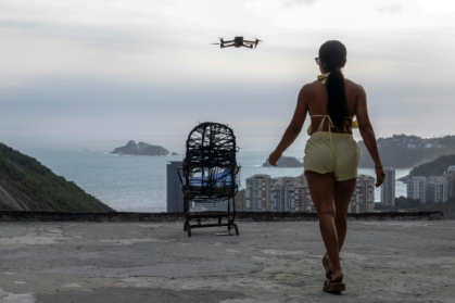 Set to an infectious beat, the video of the Rocinha favela has exploded on social media at a time when the city is drawing record tourists - Pablo PORCIUNCULA (AFP)