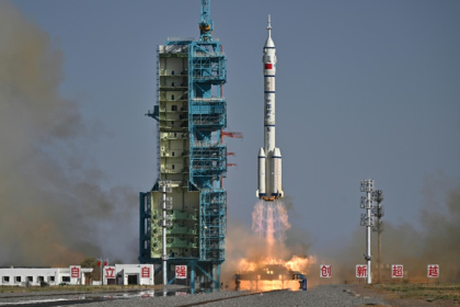 A Long March-2F carrier rocket, carrying the Shenzhou-20 spacecraft and a crew of three astronauts, lifts off from the Jiuquan Satellite Launch Centre in the Gobi desert - Pedro Pardo (AFP)