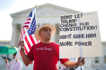 Michael Martinez demonstrates outside the US Supreme Court ahead of the birthright case - Al Drago (AFP)