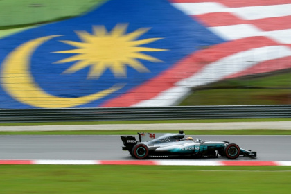 Lewis Hamilton races at the 2017 Malaysian Grand Prix while driving for Mercedes - MANAN VATSYAYANA (AFP)