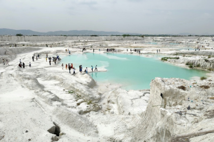 The site is blanketed in white slurry and discarded stone generated when marble and granite blocks are cut and polished. - Himanshu SHARMA (AFP)