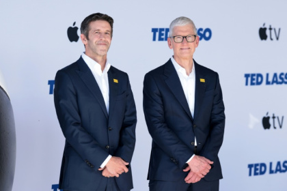 John Ternus (left), takes over as Apple chief executive, with Tim Cook (right) becoming executive chairman - VALERIE MACON (AFP)